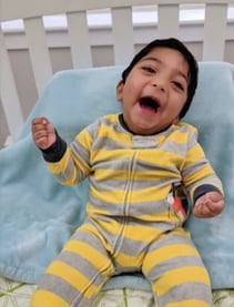 raghav as a baby in crib